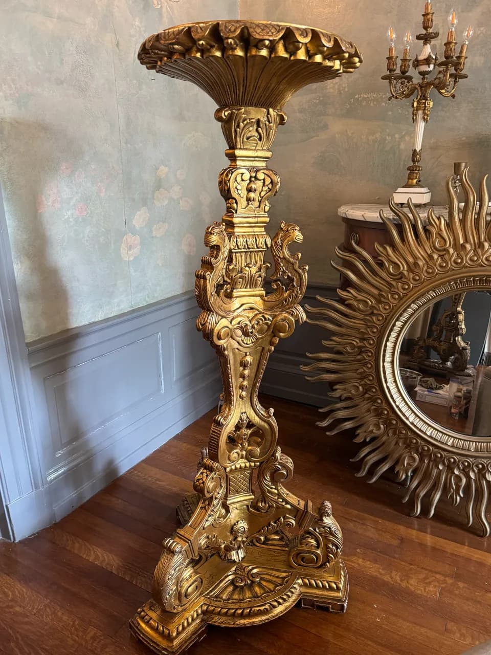 The same gilded pedestal with the carving dusted and the gold finish bright again after the clean