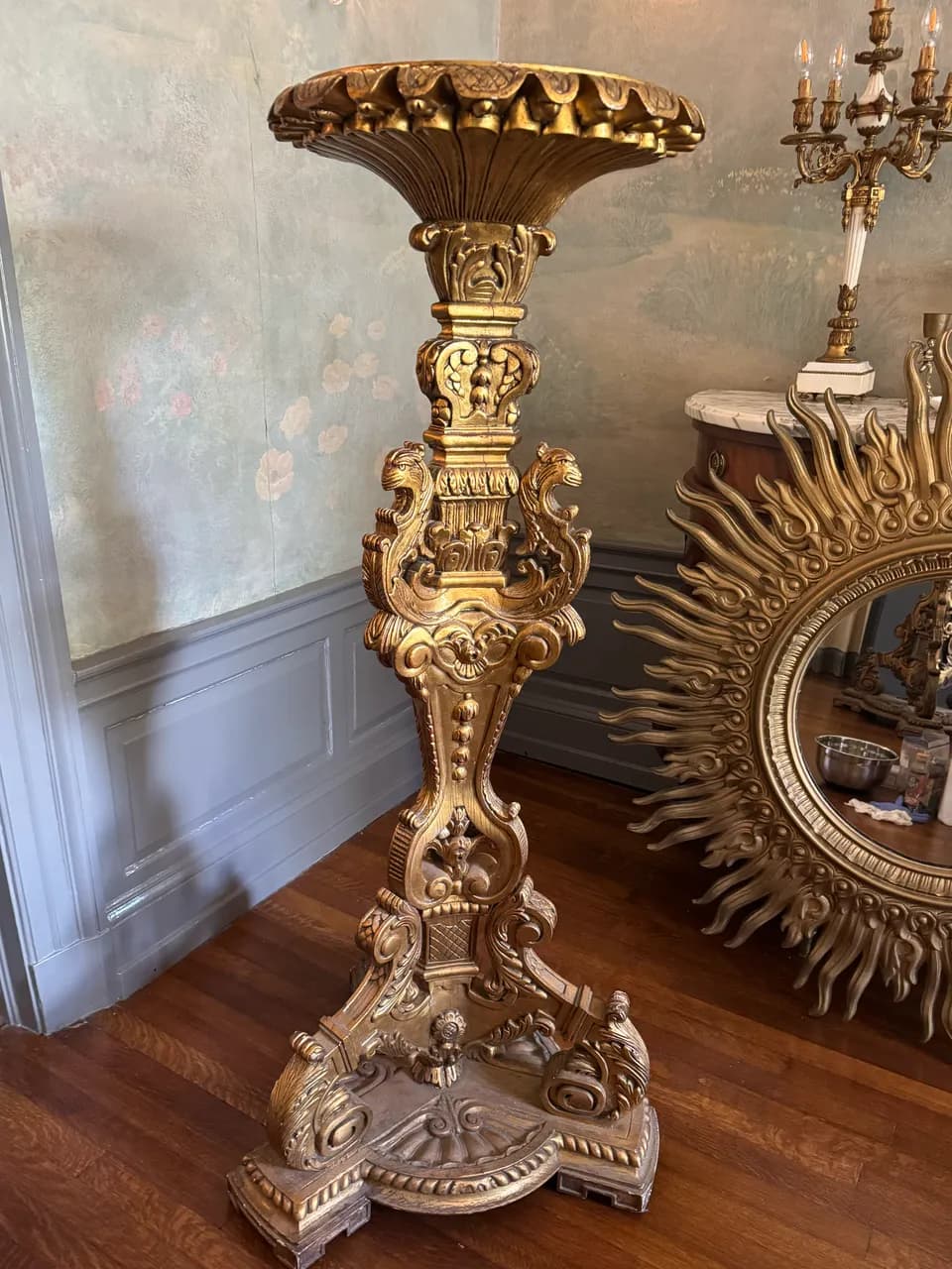 Carved gilded pedestal dulled by dust in the carving before a PenguinPro deep clean in Savannah, GA